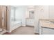 Bathroom showcasing double sink vanity, shower with glass door, and soaking tub at 2025 Wyndham Pl, Conyers, GA 30013
