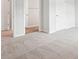 Bedroom with neutral carpet, white trim, base boards, and doors to bathroom and closet at 2025 Wyndham Pl, Conyers, GA 30013