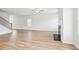 Spacious living room features bright, white walls and wood-look floors at 2025 Wyndham Pl, Conyers, GA 30013
