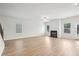 Living room featuring bright, white walls, a fireplace and wood-look floors at 2025 Wyndham Pl, Conyers, GA 30013