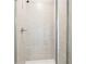 Walk-in shower features glass door and grey tile at 2025 Wyndham Pl, Conyers, GA 30013