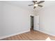 Spacious bedroom with hardwood floors, a ceiling fan, and a connecting doorway at 3286 Bachelor St, East Point, GA 30344