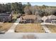 An aerial view showcases this beautiful home with a spacious yard in a quiet neighborhood at 4837 Mystere Cir, Lilburn, GA 30047
