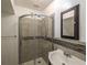 Bathroom featuring glass shower, tile, and a vanity with storage at 4837 Mystere Cir, Lilburn, GA 30047