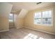 Bedroom with carpet flooring, neutral walls, and natural light through two windows at 4837 Mystere Cir, Lilburn, GA 30047