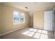 Bedroom with carpet flooring, neutral walls, and natural light streaming in through the window at 4837 Mystere Cir, Lilburn, GA 30047
