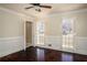 Comfortable bedroom with hardwood floors, wainscoting, shuttered windows, and ceiling fan at 4837 Mystere Cir, Lilburn, GA 30047