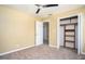 Bedroom with carpet flooring, neutral walls, and an open closet for plenty of storage at 4837 Mystere Cir, Lilburn, GA 30047