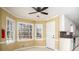 Inviting breakfast nook with views of backyard, and easy access to kitchen and side door at 4837 Mystere Cir, Lilburn, GA 30047
