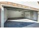 Spacious garage with ample storage space and a clean epoxy floor at 4837 Mystere Cir, Lilburn, GA 30047