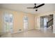 Inviting living room featuring tile floors, shuttered windows, and easy access to other living spaces at 4837 Mystere Cir, Lilburn, GA 30047