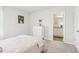 Serene bedroom with neutral walls and convenient access to the bathroom at 2029 Wyndham Pl, Conyers, GA 30013