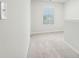 Bright hallway showcasing a window providing ample natural light at 2029 Wyndham Pl, Conyers, GA 30013