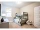 Cozy bedroom with a bunk bed, desk, and patterned ottoman at 2130 Manor Pointe Dr, Cumming, GA 30041