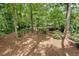 A sloped backyard with mature shade trees at , Atlanta, GA 30329