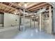 A basement with exposed piping, wooden support beams and a painted concrete floor at , Atlanta, GA 30329