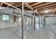 A basement with exposed piping, wooden support beams and a painted concrete floor at , Atlanta, GA 30329