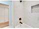 Bathroom with white marble tile, a shower, and a tub at , Atlanta, GA 30329