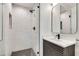 Modern bathroom featuring a glass shower, marble tile, and sleek vanity at , Atlanta, GA 30329