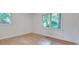 Bright bedroom with hardwood floors and natural light from two windows at , Atlanta, GA 30329