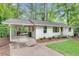 A white brick home with a carport and a wooden deck at , Atlanta, GA 30329