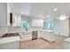 Updated kitchen with white cabinetry, stainless steel appliances, and a farmhouse sink, bathed in natural light at , Atlanta, GA 30329