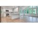 Spacious, updated kitchen featuring white cabinetry, stainless steel appliances, and beautiful hardwood flooring at , Atlanta, GA 30329