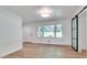 Bright living room featuring gleaming hardwood floors, fresh white paint, and an elegant sliding barn door at , Atlanta, GA 30329