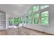 Bright sunroom with lots of windows, hardwood floors, and a door leading to an outdoor deck at , Atlanta, GA 30329