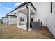 Back patio with privacy fence, well-maintained lawn, and outdoor air conditioning unit at 1120 Sunny Lake Dr, Lawrenceville, GA 30043