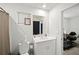 Bright bathroom featuring a toilet, shower, vanity with sink, mirror, and modern fixtures at 1120 Sunny Lake Dr, Lawrenceville, GA 30043