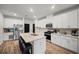 Modern kitchen with a center island, white cabinets, and stainless steel appliances at 1120 Sunny Lake Dr, Lawrenceville, GA 30043