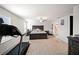 The spacious main bedroom includes a ceiling fan, accent wall, and a large window with natural light at 1120 Sunny Lake Dr, Lawrenceville, GA 30043