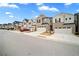 Street view of modern townhomes each with a driveway and garage at 1120 Sunny Lake Dr, Lawrenceville, GA 30043