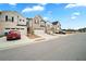 Charming townhomes featuring attached garages, driveways, and manicured lawns under a blue sky at 1120 Sunny Lake Dr, Lawrenceville, GA 30043