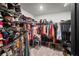 Spacious walk-in closet with custom shelving and ample storage for shoes, clothes, and accessories at 1120 Sunny Lake Dr, Lawrenceville, GA 30043