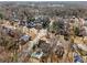 An aerial view of a neighborhood featuring mature trees and well-maintained homes with neat landscaping at 2109 Rugby Ave, Atlanta, GA 30337