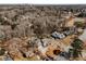 An aerial shot showcases the houses in a quiet, wooded neighborhood, featuring mature trees at 2109 Rugby Ave, Atlanta, GA 30337