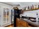 Wet bar includes a wine cooler, cabinetry, counter space and a door to the exterior at 2109 Rugby St, Atlanta, GA 30309