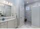 Bright bathroom with marble countertop vanity and tiled walk-in shower at 2109 Rugby St, Atlanta, GA 30309