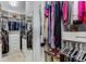 Organized walk-in closet with clothing racks and shelving for optimal storage at 2109 Rugby Ave, Atlanta, GA 30337