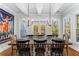 Dining room with rustic table and chairs, chandelier lighting, and natural light at 2109 Rugby St, Atlanta, GA 30309