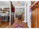 Inviting foyer with hardwood floors, a decorative barn door, and open access to the living spaces at 2109 Rugby Ave, Atlanta, GA 30337