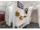 Welcoming foyer with slate flooring, bench seating, and staircase at 2109 Rugby Ave, Atlanta, GA 30337