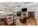 Cozy living room with coffered ceilings, a brick fireplace, and plenty of natural light at 2109 Rugby St, Atlanta, GA 30309