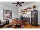 Stylish home office featuring custom shelving, hardwood floors, and a dedicated wine fridge at 2109 Rugby St, Atlanta, GA 30309