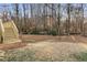 A staircase leads to the backyard with lush greenery and mature trees at 2490 Brookcliff Ne Way, Atlanta, GA 30345