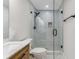 Beautiful bathroom featuring a glass-enclosed shower and a wood vanity with marble countertop at 2490 Brookcliff Ne Way, Atlanta, GA 30345