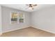 Bright bedroom featuring a ceiling fan, hardwood floors, and a window with natural light at 2490 Brookcliff Ne Way, Atlanta, GA 30345