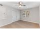 Bright bedroom with hardwood floors, closet, ceiling fan, and natural light from the window at 2490 Brookcliff Ne Way, Atlanta, GA 30345